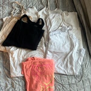 Pile of random woman’s tanks to wear under things.